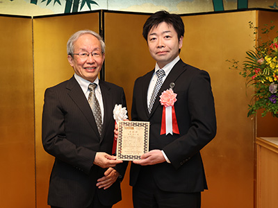 情報通信技術標準化奨励賞 飯塚 浩人 様